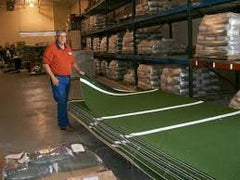 Owner Arnald Swift at factory with stacks of stance mats, we get them from the source